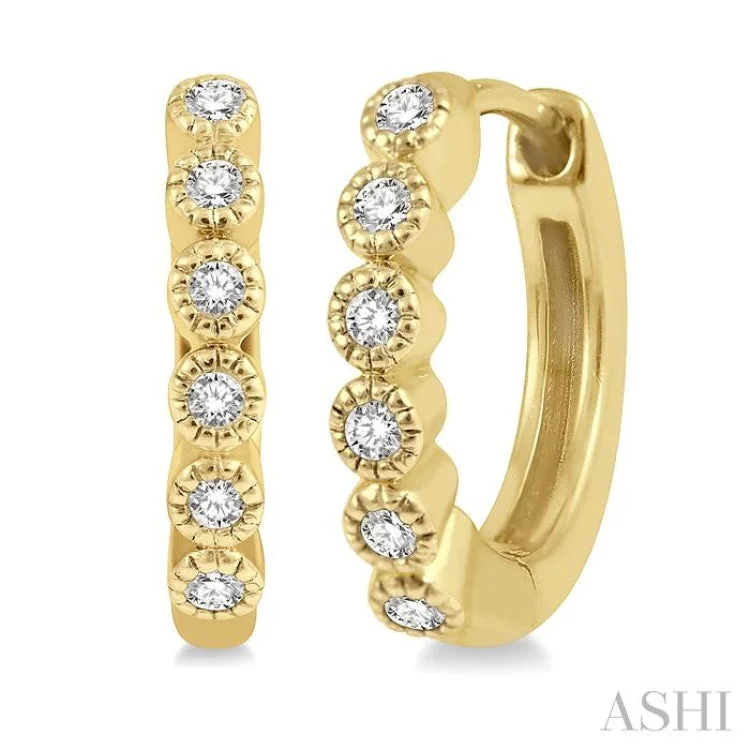 1/10 ctw Round Cut Diamond Huggie Earrings in 10K Yellow Gold